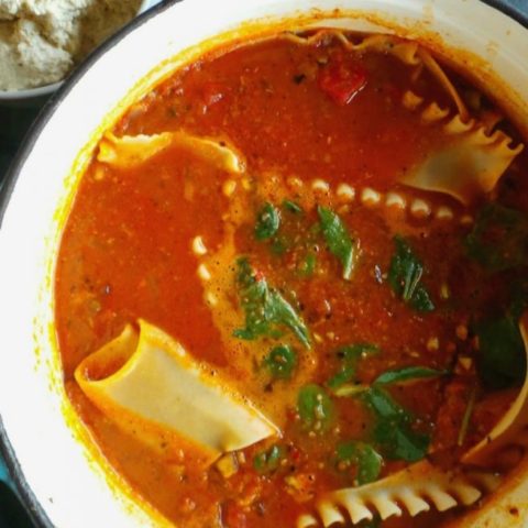 Vegan & GF Lasagna Soup, loaded with veggies, topped with spinach and fresh tofu ricotta.