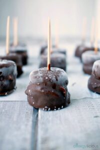 Homemade frozen, bites made with real ingredients, like banana, SunButter then covered in Top 8 free chocolate.