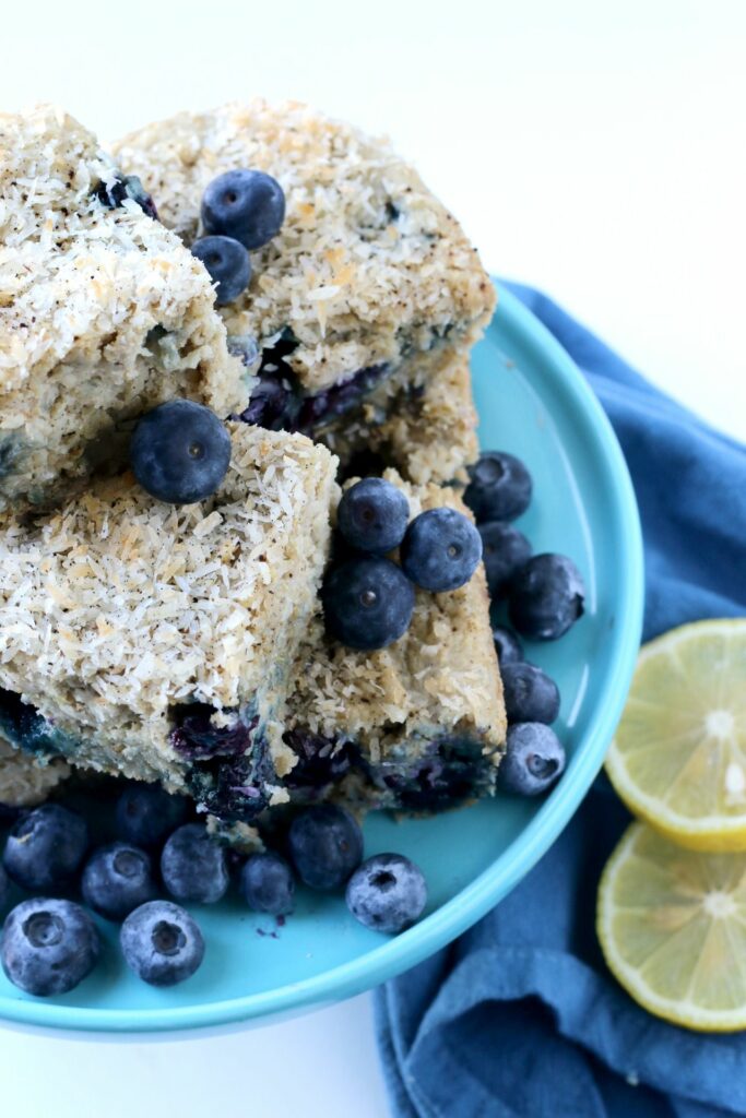 Each delightful bite of this Blueberry Lemon Snack Cake is bursting with fresh berries, lemon & sweet coconut. 