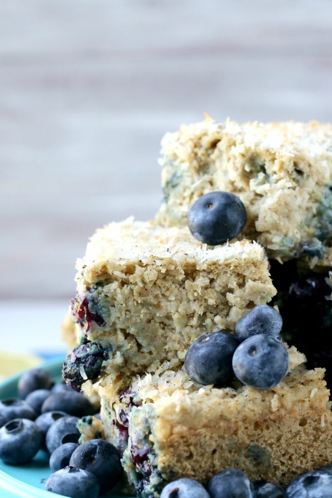 Each delightful bite of this Blueberry Lemon Snack Cake is bursting with fresh berries, lemon & sweet coconut. 