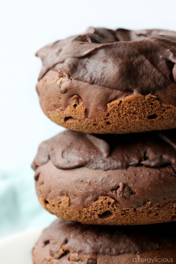 closeup of chocolate donuts stacked high