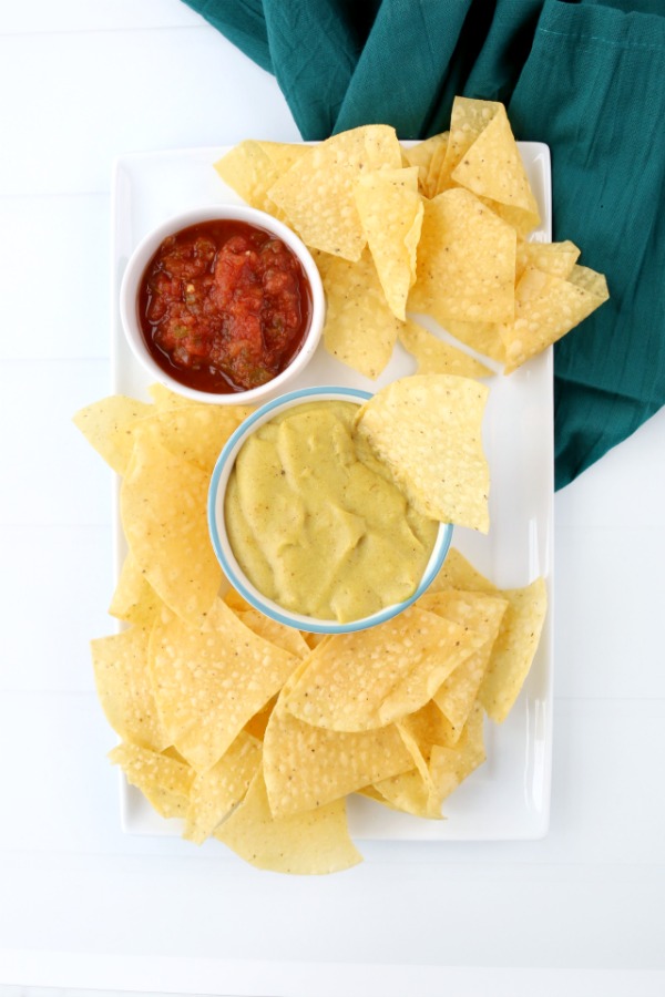 Vegan cheese sauce with nachos and salsa