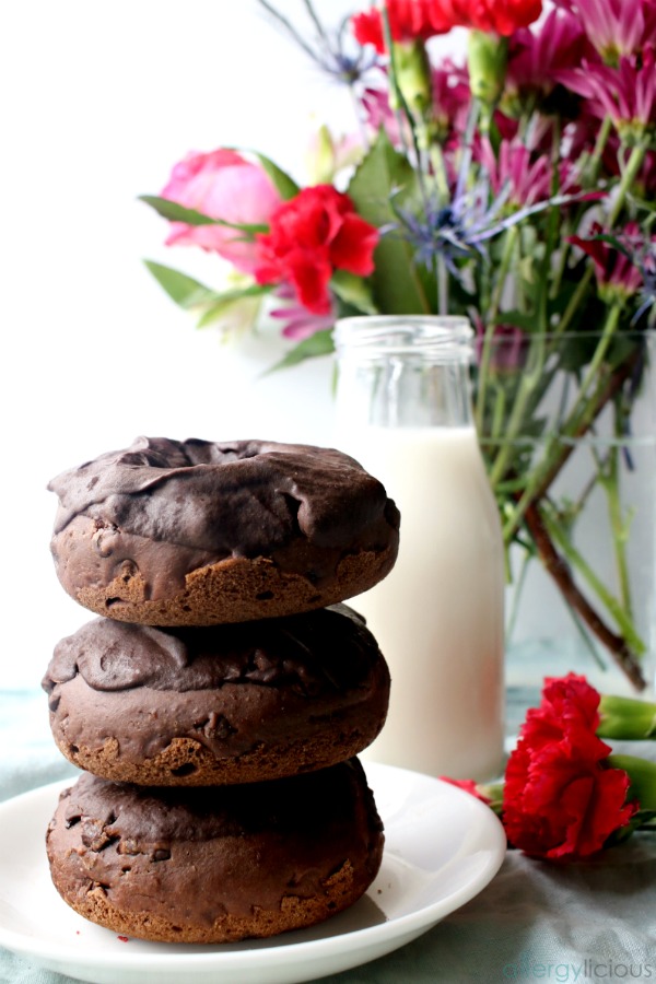 Chocolate donuts stack with milk and flowers